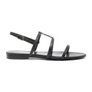 Saint Laurent Svarta platta sandaler med guldlogotyp Black, Dam