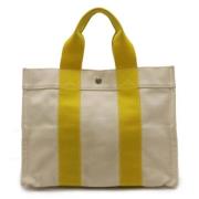 Hermès Vintage Pre-owned Canvas handvskor Yellow, Dam