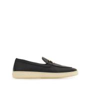 Salvatore Ferragamo Svarta platta slip-on skor med guldtonad logotyp B...