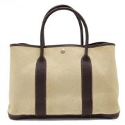 Hermès Vintage Pre-owned Canvas handvskor Beige, Dam