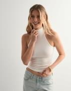Nelly - Vit - Sleeveless Polo Top